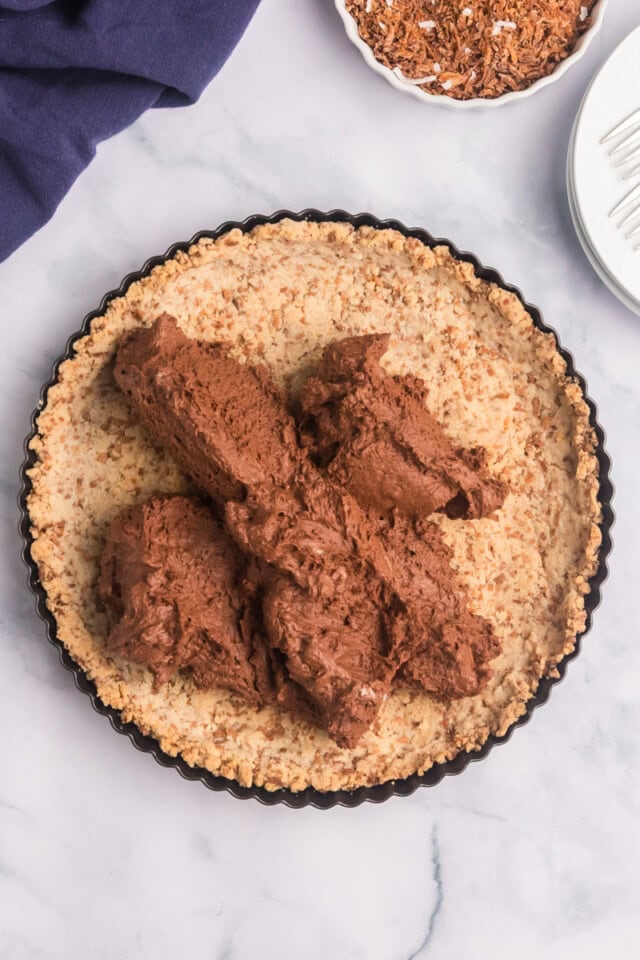 overhead view of chocolate mousse pie filling in a coconut crust