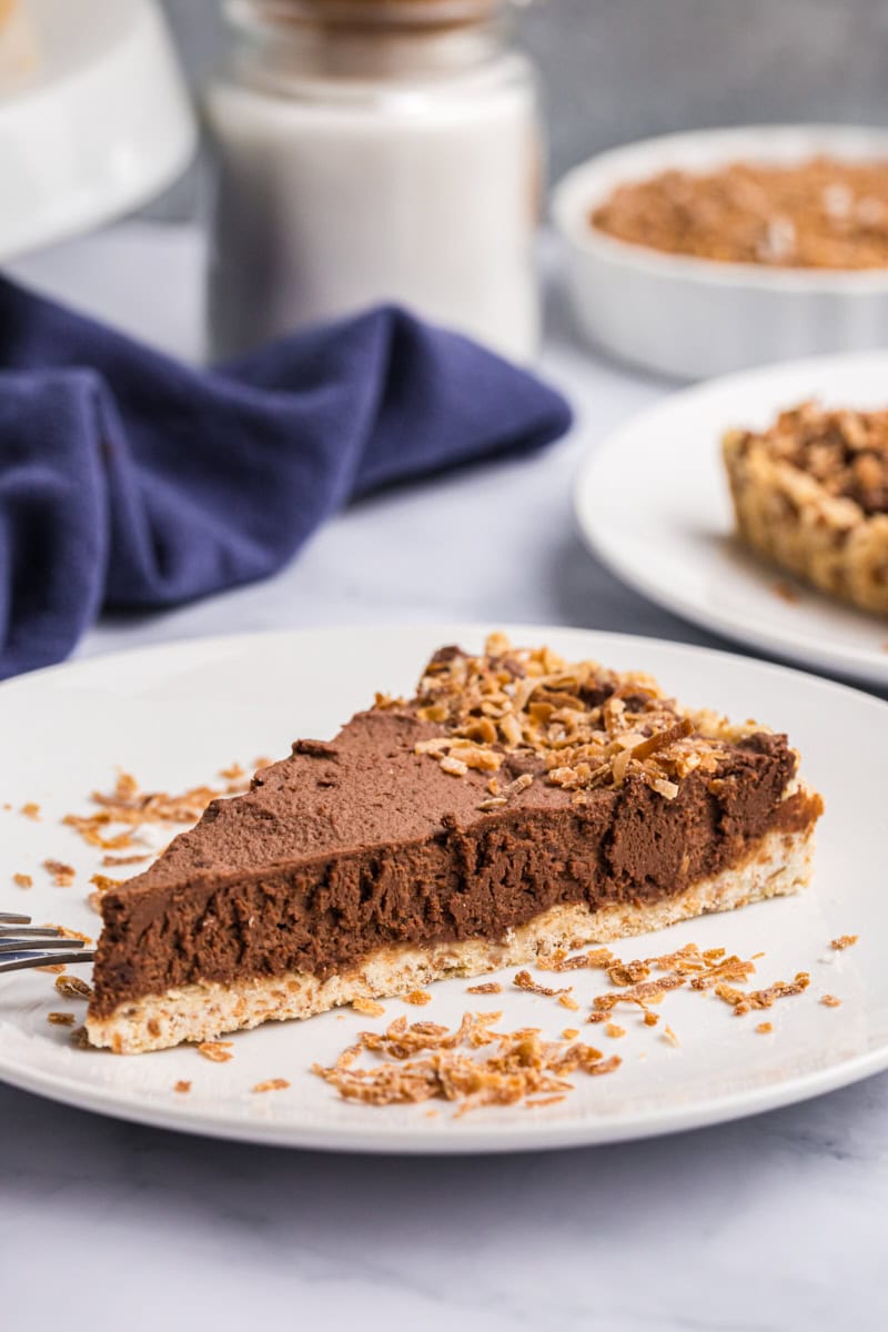 a slice of chocolate mousse pie on a white plate