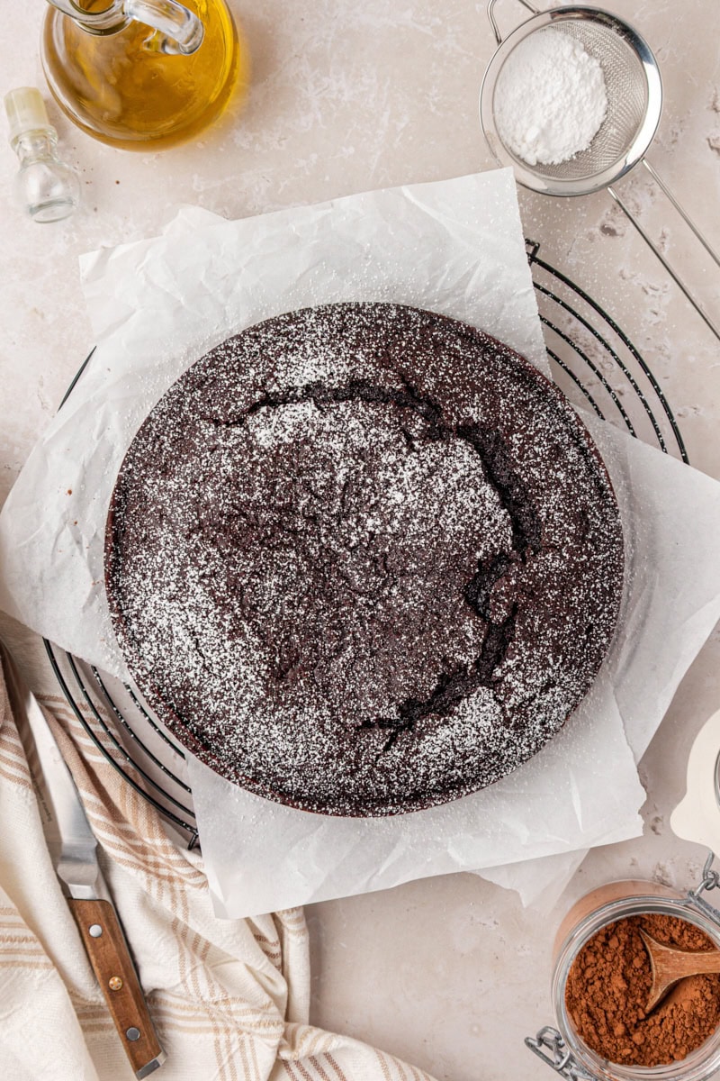 overhead view of chocolate olive oil cake dusted with powdered sugar