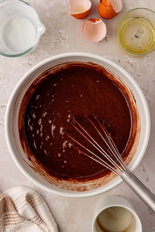 overhead view of chocolate olive oil cake batter in a mixing bowl