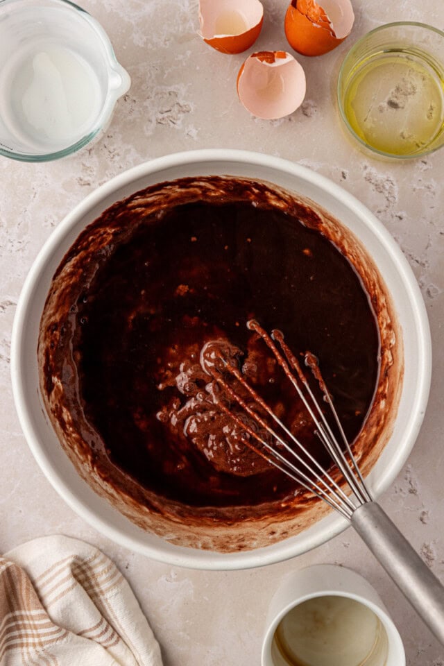 overhead view of hot coffee added to chocolate olive oil cake batter