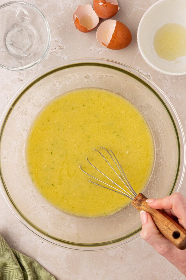 melted butter, oil, eggs, coconut milk, sour cream, lime juice, and coconut extract combined in a mixing bowl