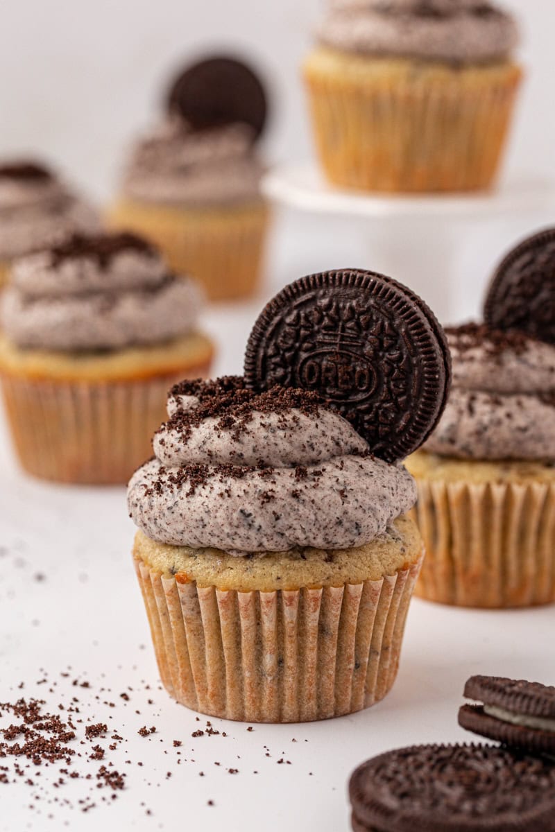 a cookies and cream cupcake topped with Oreo buttercream and a whole cookie