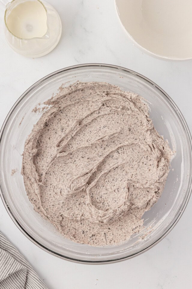 overhead view of Oreo buttercream in a glass mixing bowl