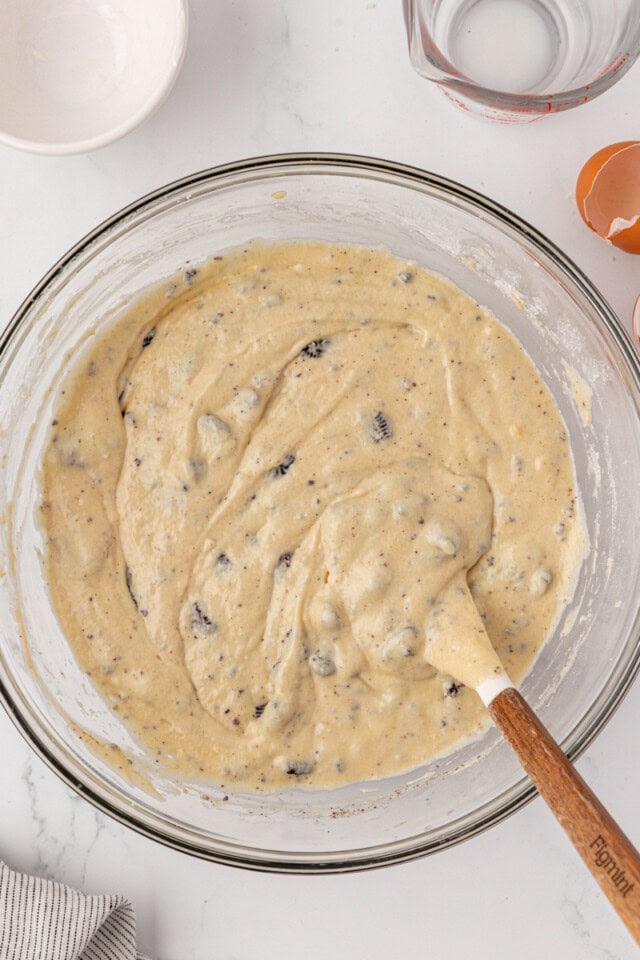 overhead view of cookies and cream cupcake batter in a glass mixing bowl