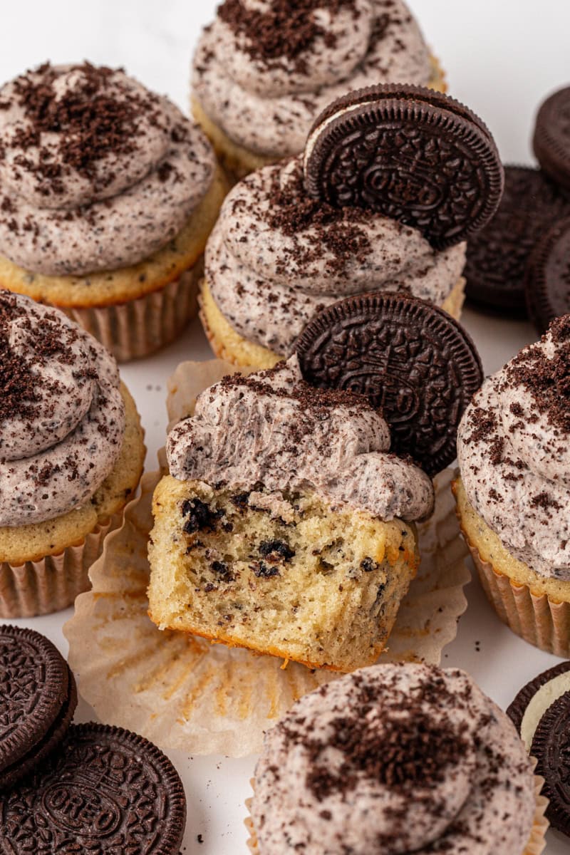 several cookies and cream cupcakes topped with Oreo buttercream