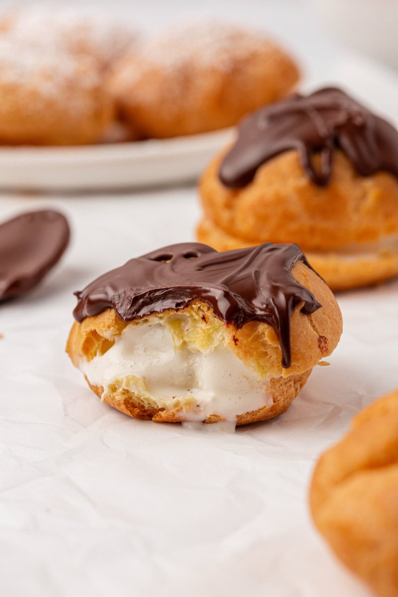 an ice-cream filled profiterole with a bite missing