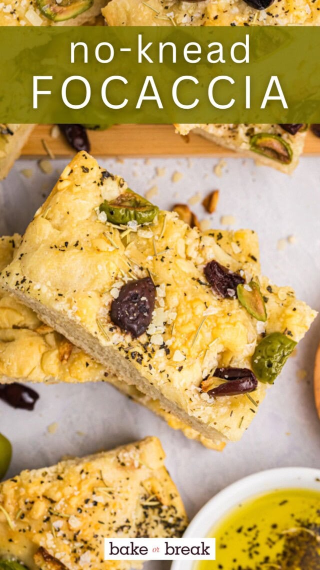 overhead view of a slice of no-knead focaccia topped with herbs, cheese, and olives; text overlay "no-knead focaccia bake or break"