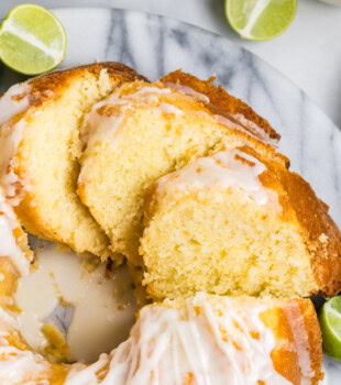 overhead view of partially sliced Key lime Bundt cake topped with a lime glaze