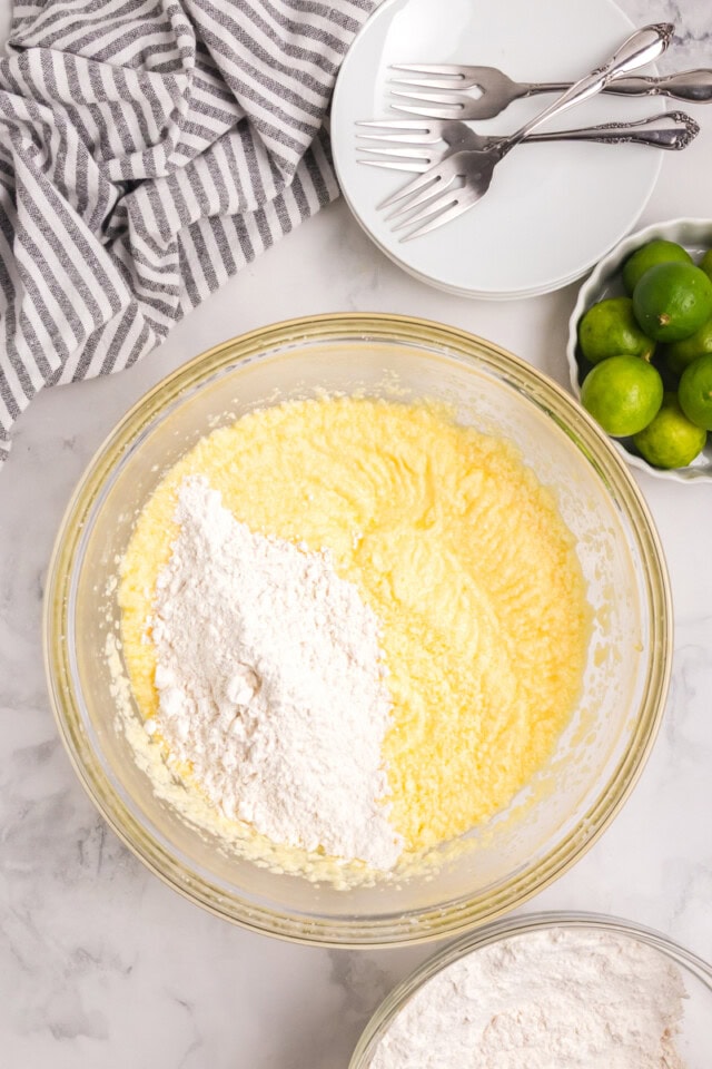 overhead view of dry ingredients added to wet ingredients for Key lime Bundt cake