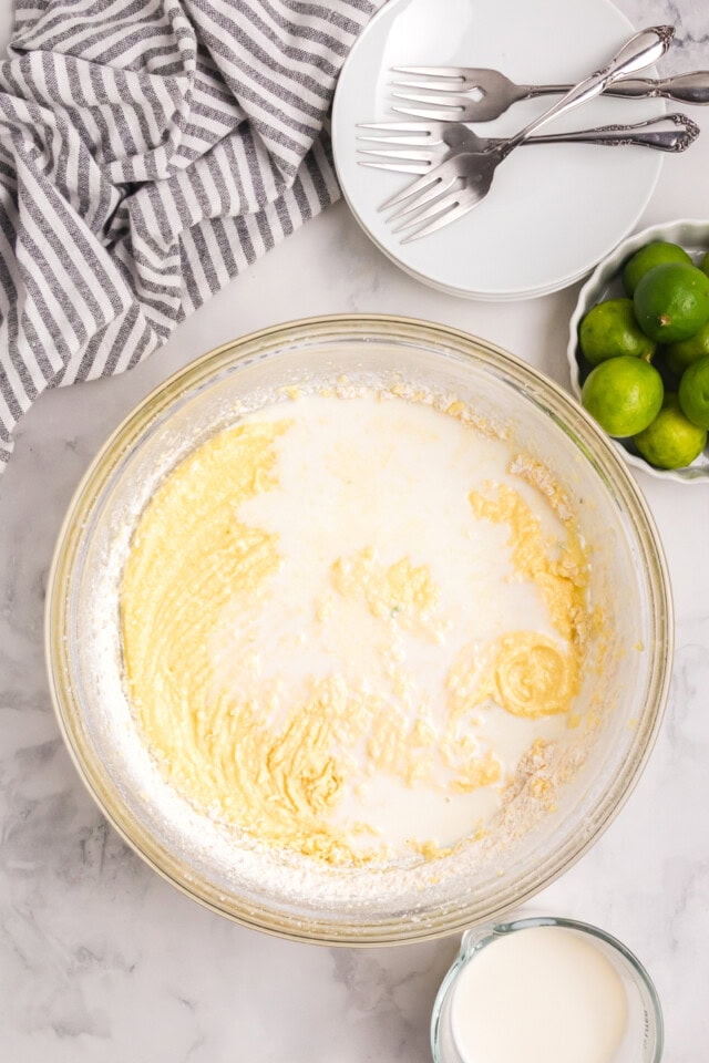 overhead view of milk added to Key lime Bundt cake batter