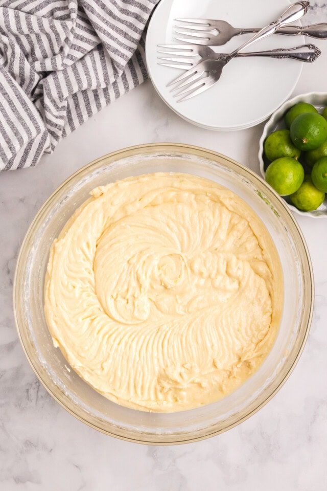 overhead view of Key lime Bundt cake batter in a glass mixing bowl