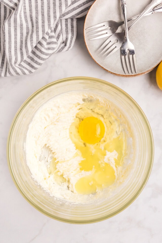 overhead view of egg and lemon juice added to creamed butter and sugar
