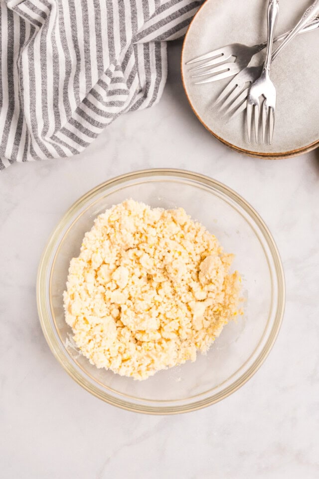 overhead view of lemon crumb topping in a mixing bowl