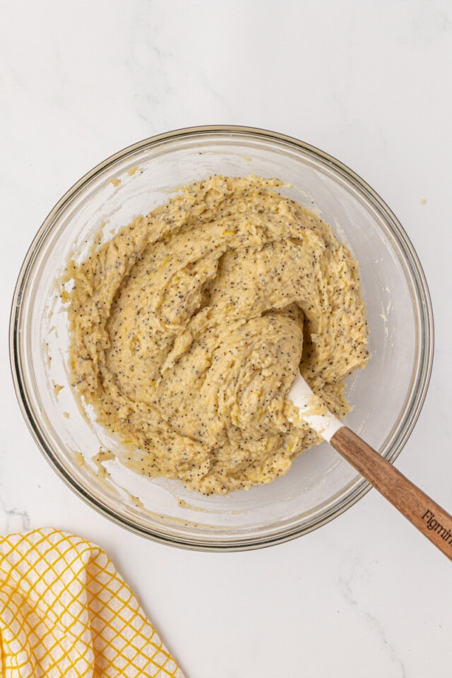overhead view of lemon poppy seed muffin batter in a mixing bowl