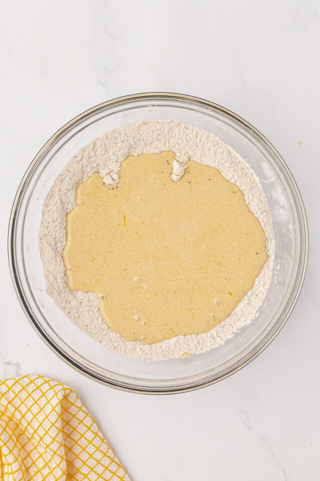 wet ingredients added to dry ingredients for muffin batter