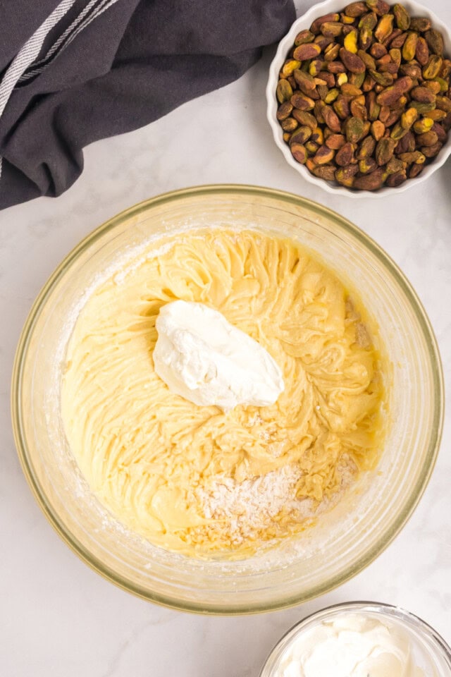 overhead view of sour cream added to cake batter