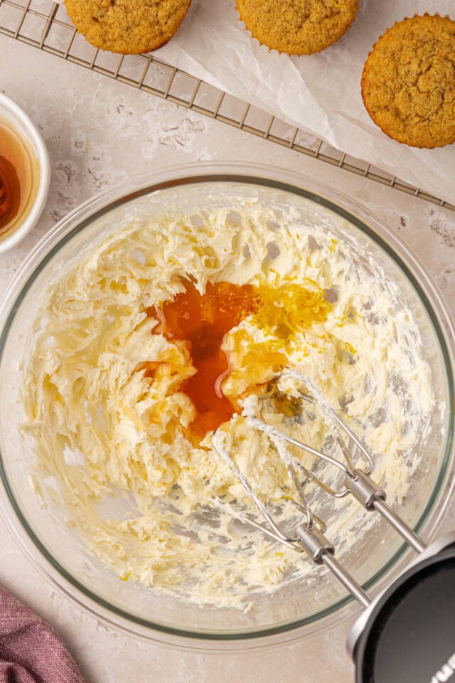 overhead view of honey and lemon zest added to creamed butter and sugar