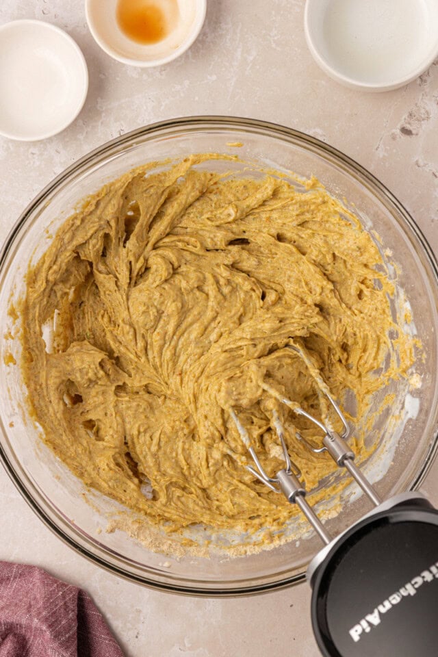 overhead view of pistachio cupcake batter in a mixing bowl