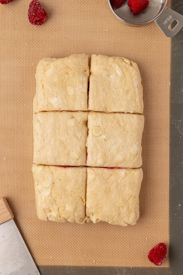 raspberry white chocolate scone dough shaped and cut into squares