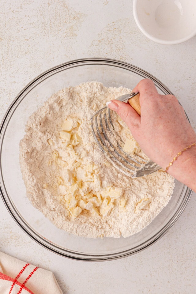 butter being cut into dry ingredients