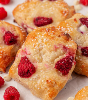 close-up of a raspberry white chocolate scone showing tender crumb