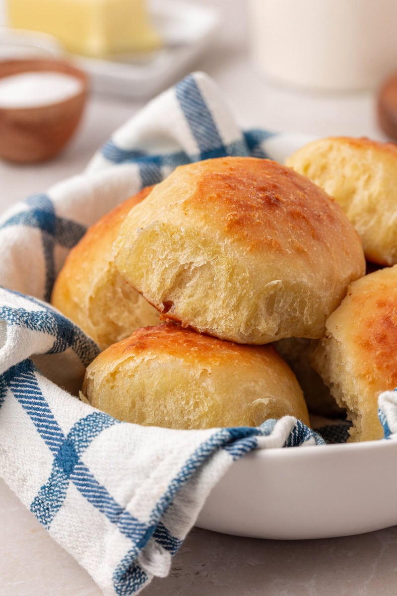 soft, fluffy dinner rolls piled in a bowl
