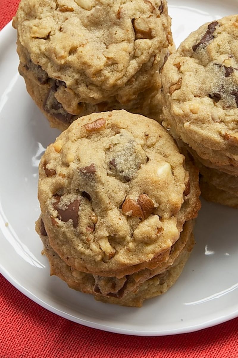 nutty peanut butter cookies stacked on a white plate