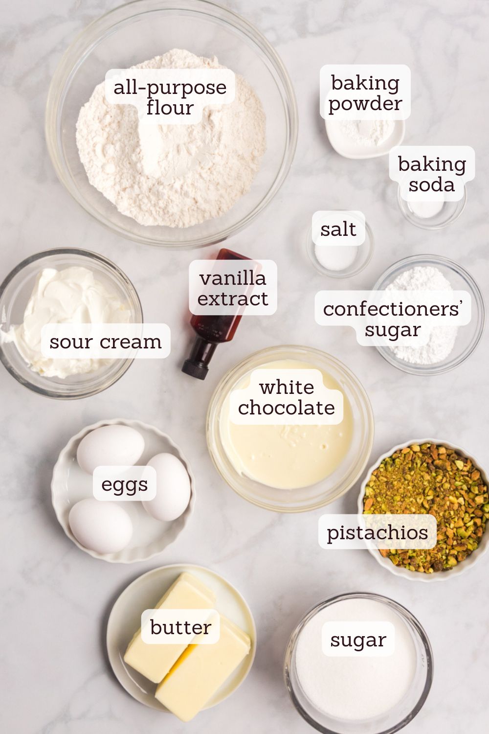 overhead view of ingredients for pistachio cake with white chocolate frosting