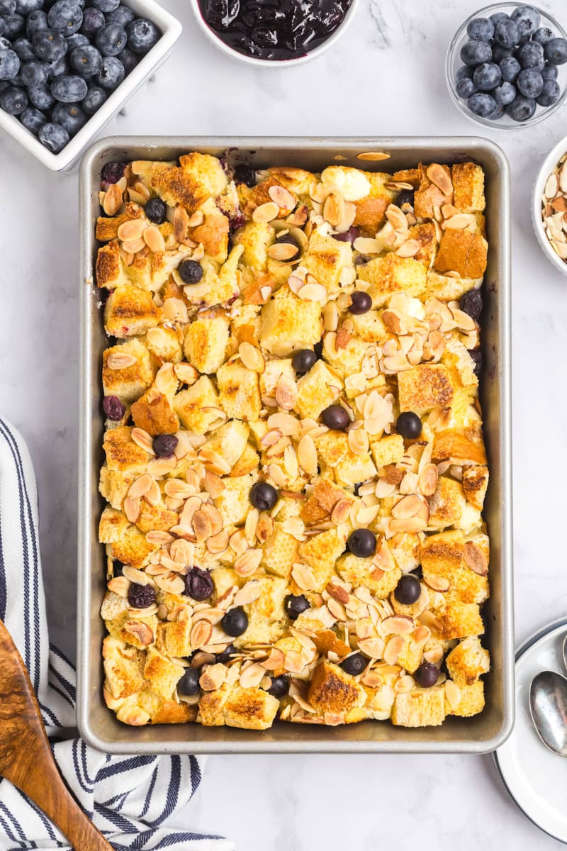 overhead view of freshly baked blueberry bread pudding in a 9x13 pan
