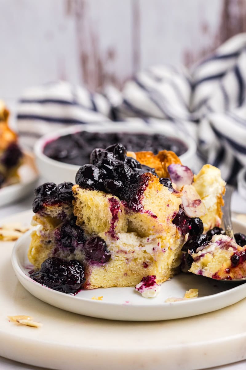 close up showing custardy texture of blueberry bread pudding
