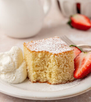 a slice of hot milk cake with a bite missing from the corner