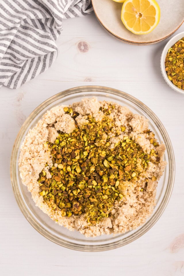overhead view of pistachios added to shortbread mixture