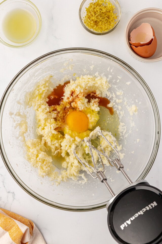 egg, vanilla extract, lemon zest, and lemon juice added to creamed butter and sugar