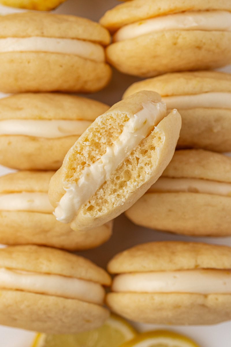 close up of a lemon whoopie pie showing the creamy filling
