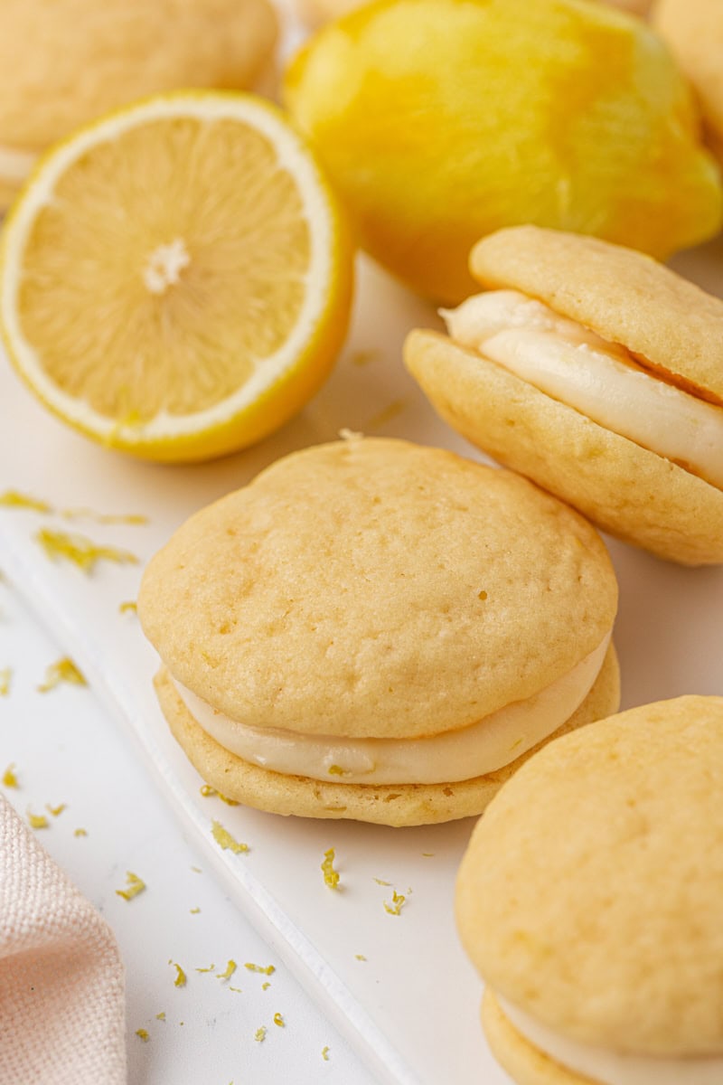 lemon whoopie pies with creamy filling on a white surface