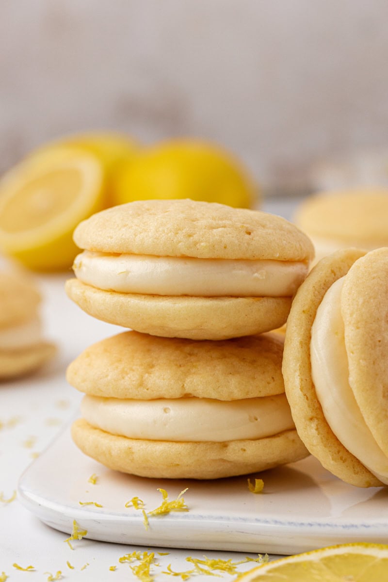 a stack of two soft lemon whoopie pies with a lemon filling