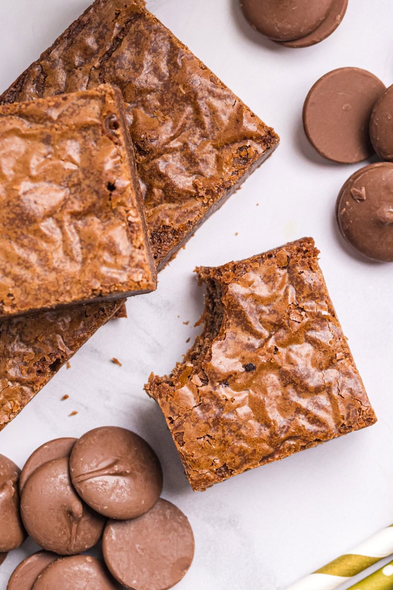 overhead view of a milk chocolate brownie with a bite missing