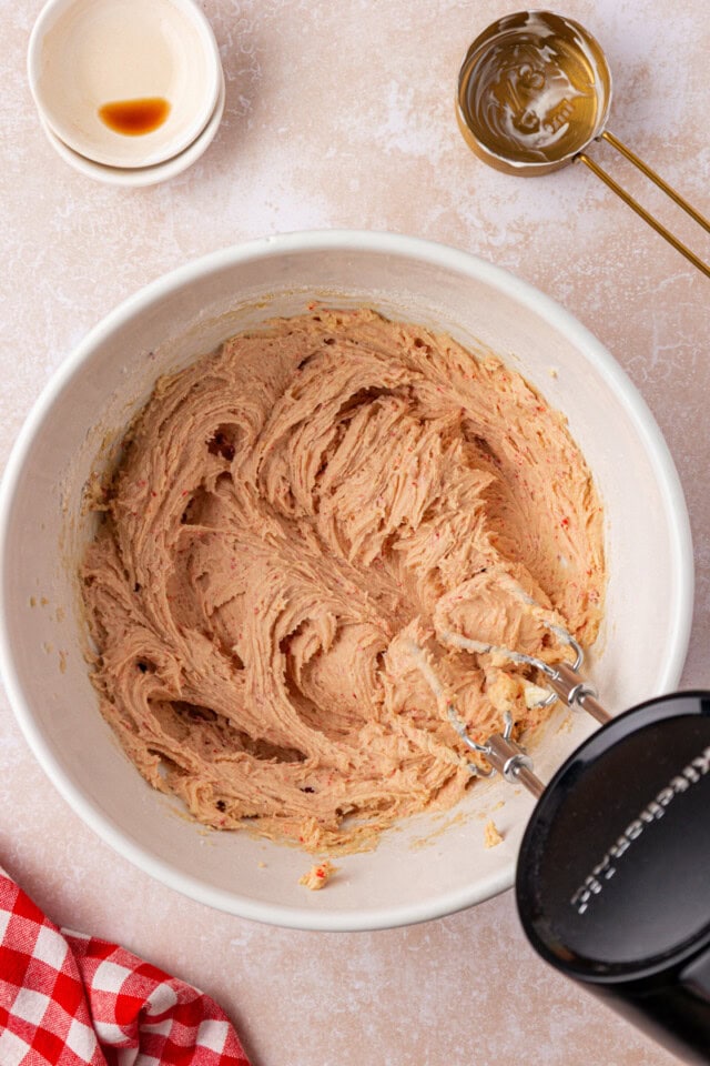 overhead view of strawberry cookie dough in a mixing bowl