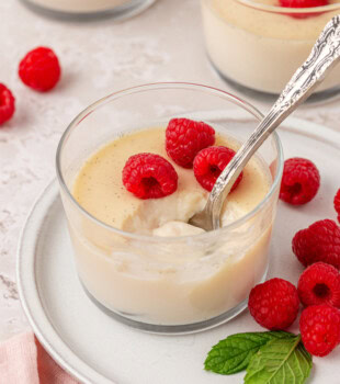 vanilla panna cotta topped with fresh raspberries