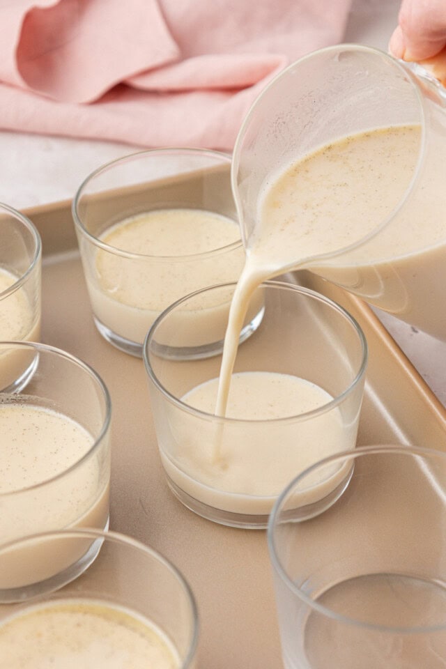vanilla panna cotta mixture being poured into a dessert glass