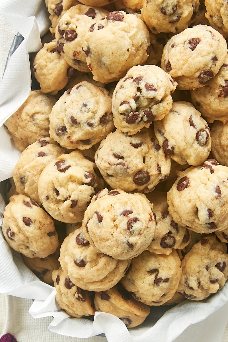 overhead view of mini chocolate chips in a towel-lined metal basket