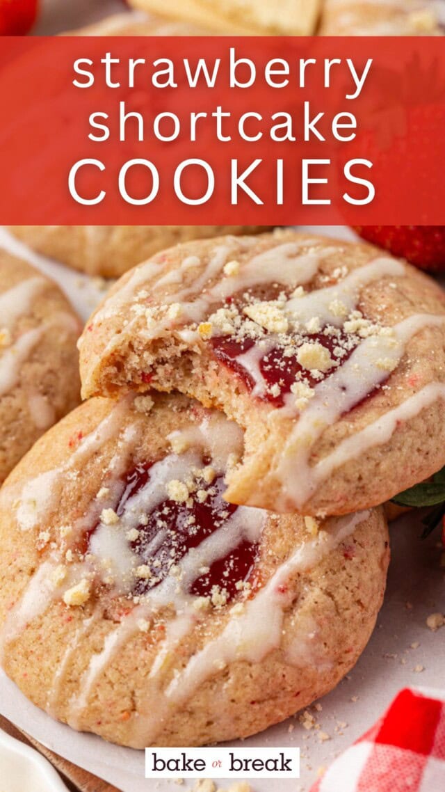 two strawberry shortcake cookies filled with jam and topped with cream glaze and shortbread crumbs; text overlay "strawberry shortcake cookies - bake or break"
