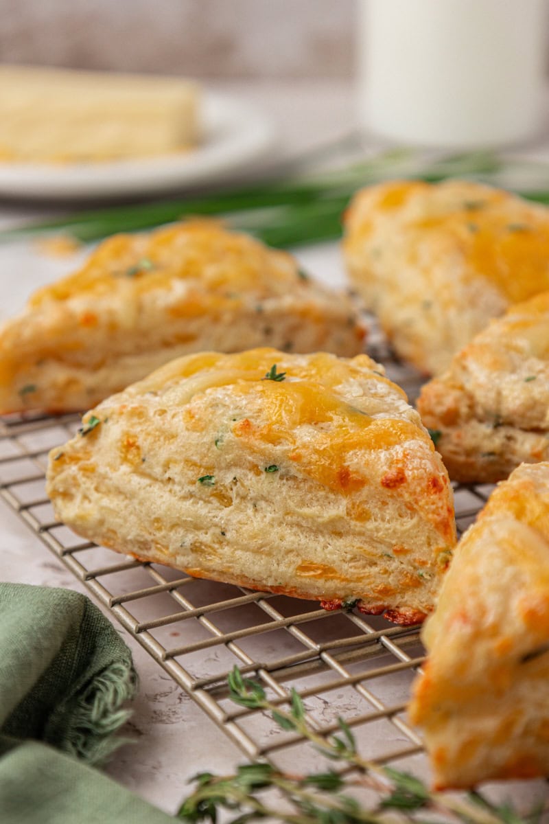 herb and cheese scones on a wire rack