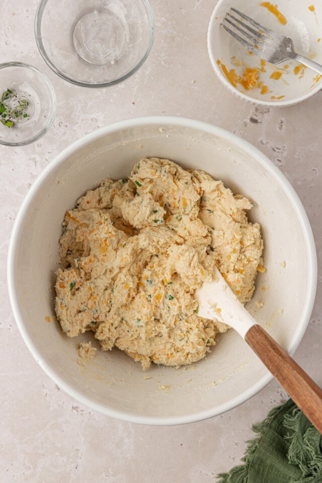 herb and cheese scone dough in a mixing bowl