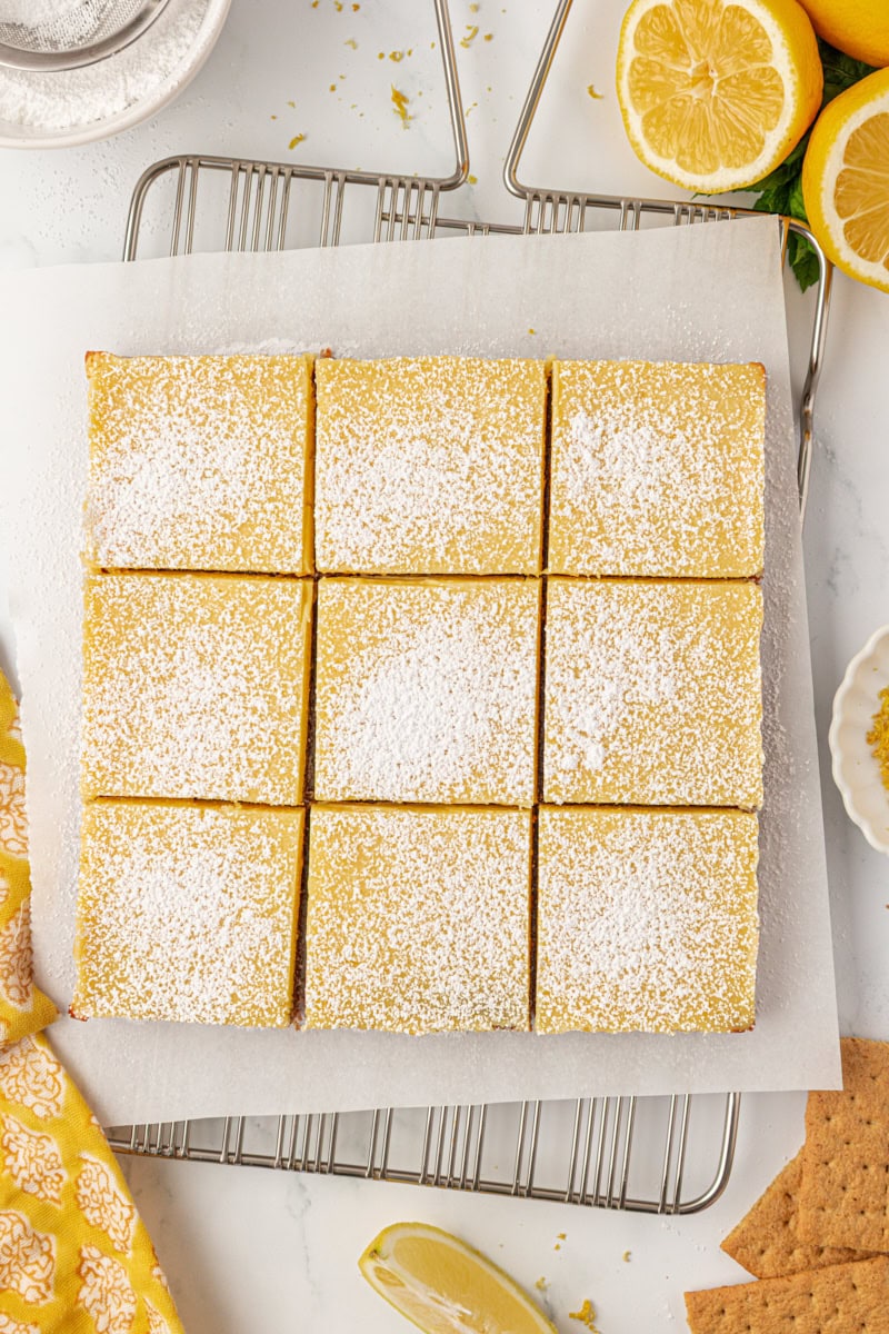 overhead view of lemon icebox bars topped with a sprinkle of confectioners' sugar