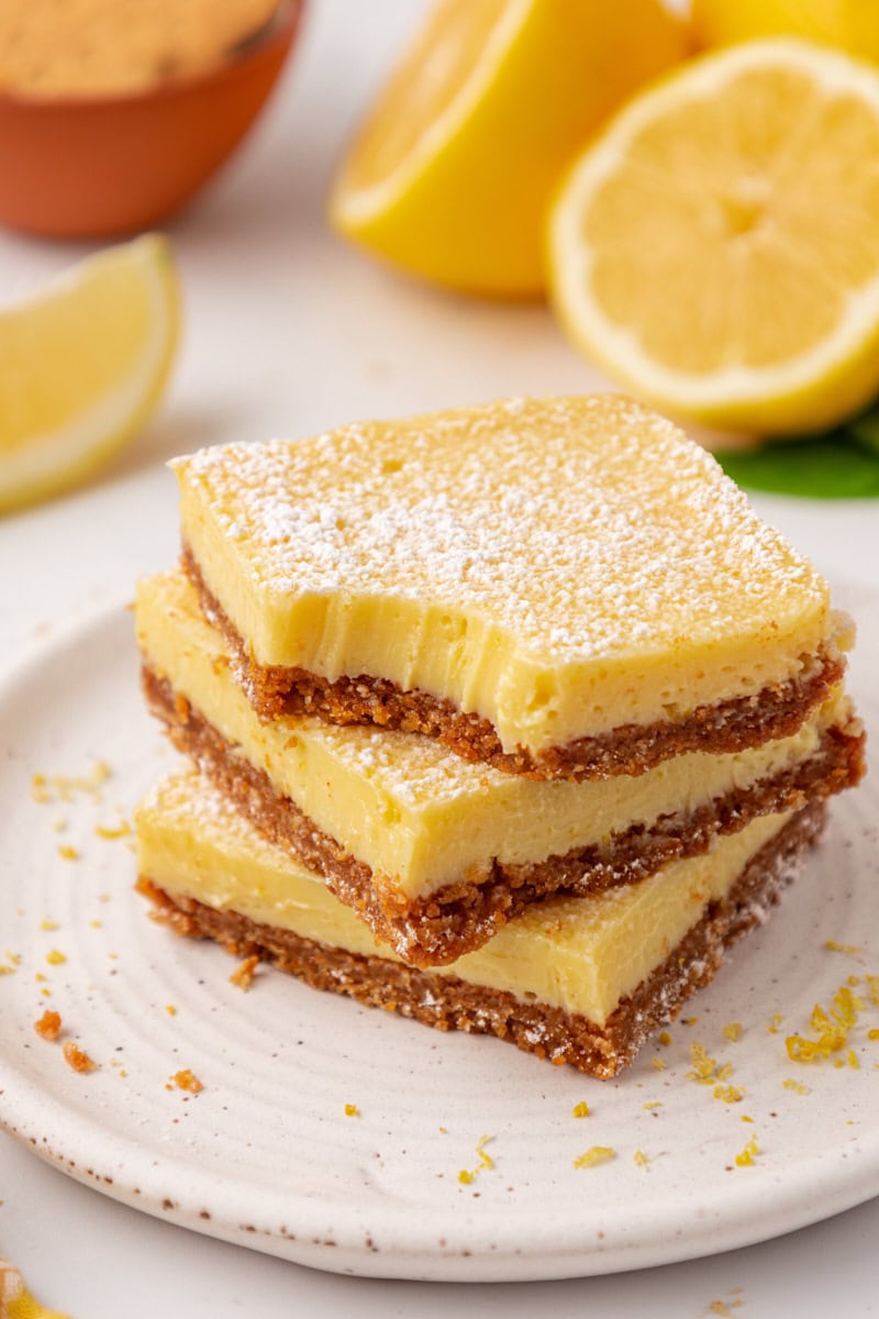 stack of three creamy lemon icebox bars with graham cracker crust