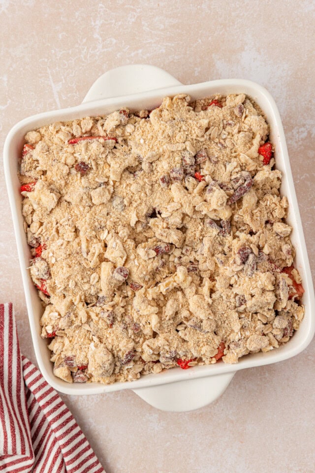 assembled strawberry crisp ready to go into the oven