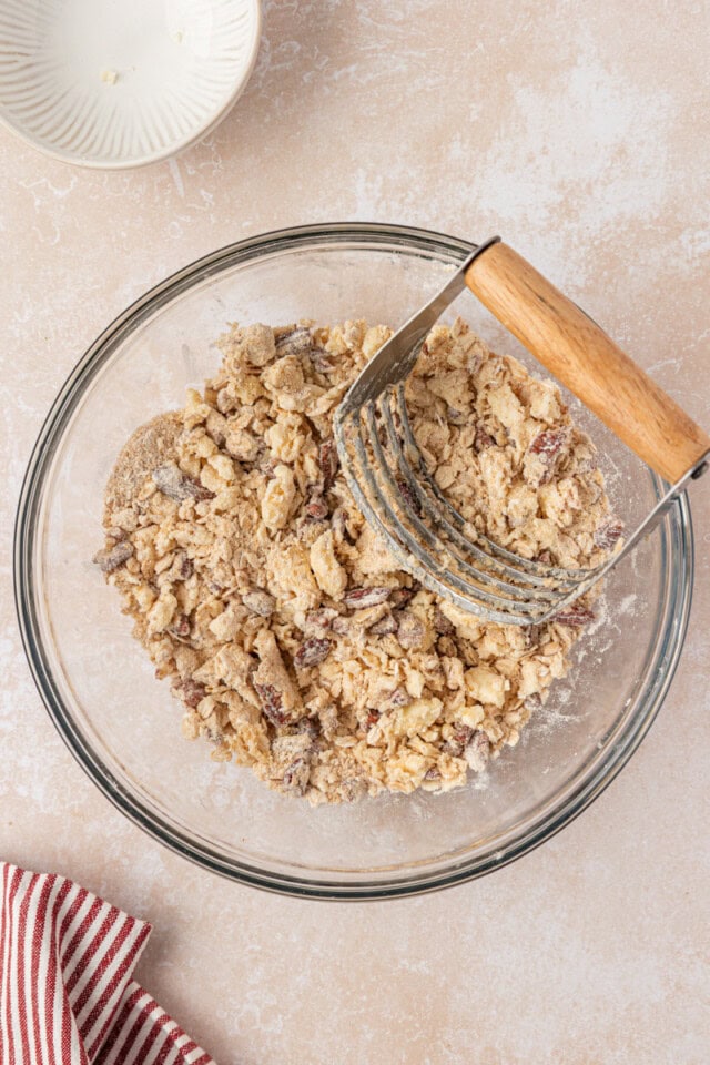 buttery oat and nut topping mixture in a mixing bowl