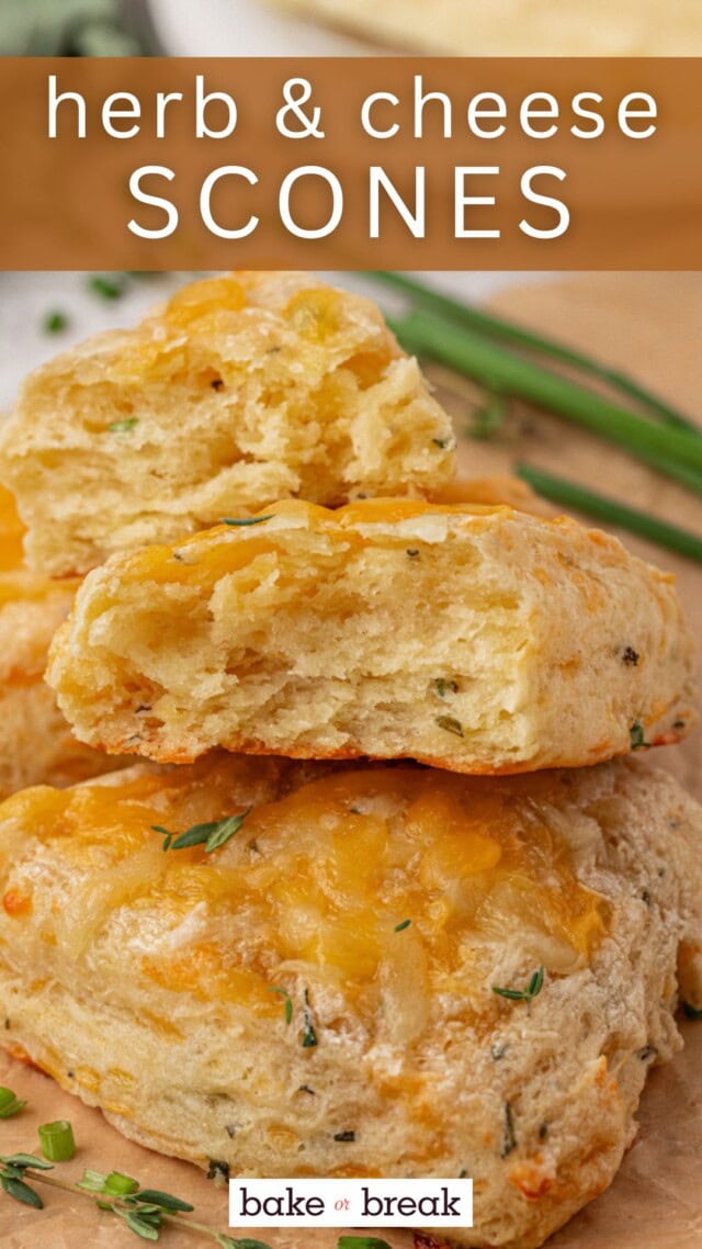 an herb and cheese scone broken apart to show the flaky layers; text overlay "herb & cheese scones - bake or break"